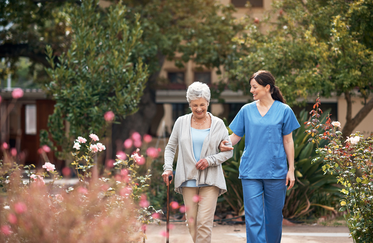 nurse walking with patient